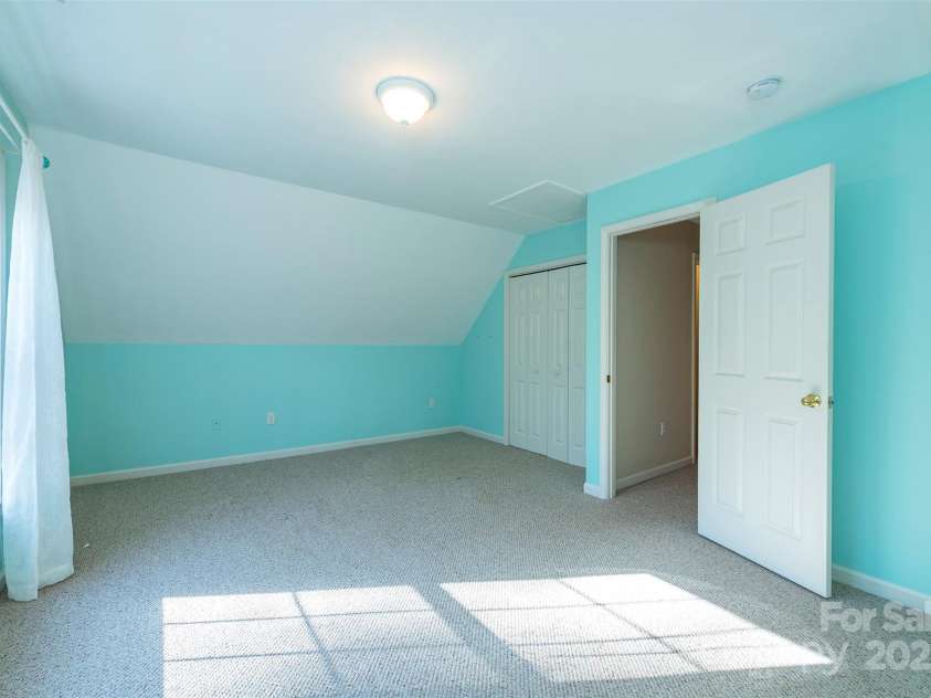 29 Beverly Grove Lane, Candler, NC 28715.  MLS# CAR4235867, YatesRealty ID 13455. Bright upstairs Bedroom