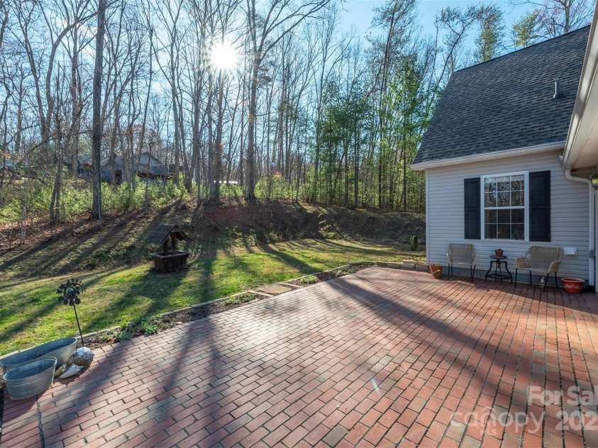 29 Beverly Grove Lane, Candler, NC 28715.  MLS# CAR4235867, YatesRealty ID 13455. Large back pation for grilling and hanging out with friends