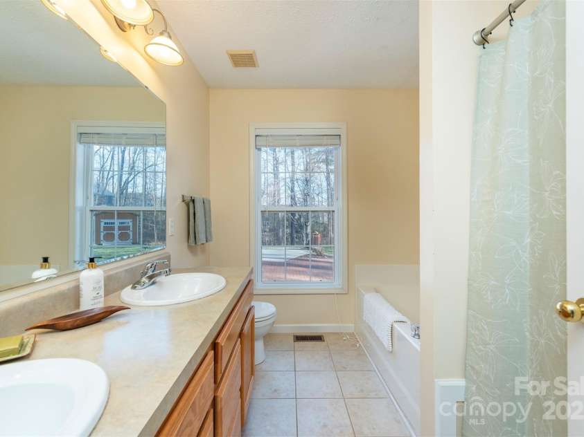29 Beverly Grove Lane, Candler, NC 28715.  MLS# CAR4235867, YatesRealty ID 13455. Primary Bath on Main Floor