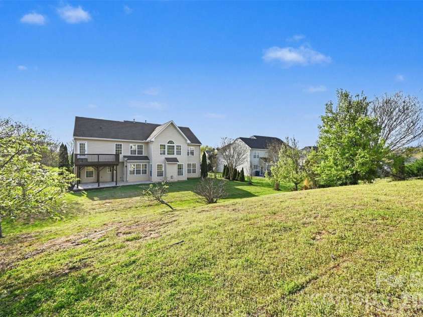 7512 Chasewater Drive, Harrisburg, NC 28075.  MLS# CAR4360354, YatesRealty ID 13455. Beautiful Yard with Various Fruit Trees