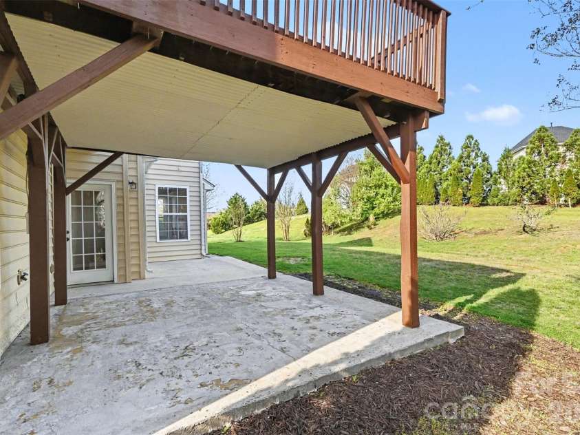 7512 Chasewater Drive, Harrisburg, NC 28075.  MLS# CAR4360354, YatesRealty ID 13455. Covered Patio under Deck