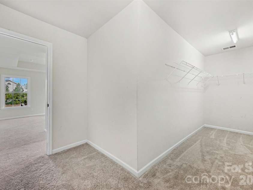 7512 Chasewater Drive, Harrisburg, NC 28075.  MLS# CAR4360354, YatesRealty ID 13455. Large Primary Bedroom Closet