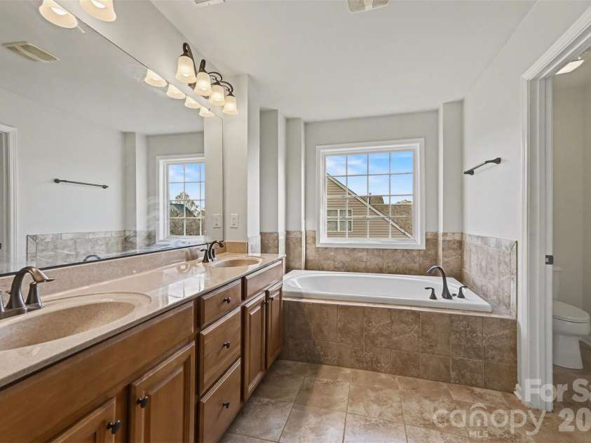 7512 Chasewater Drive, Harrisburg, NC 28075.  MLS# CAR4360354, YatesRealty ID 13455. Primary Bathroom