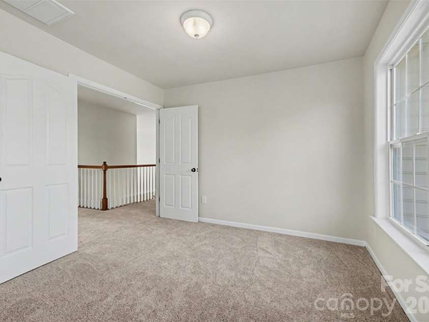 7512 Chasewater Drive, Harrisburg, NC 28075.  MLS# CAR4360354, YatesRealty ID 13455. Primary Bedroom Sitting Area, Double Doors into the Primary