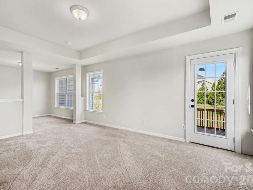7512 Chasewater Drive, Harrisburg, NC 28075.  MLS# CAR4360354, YatesRealty ID 13455. Primary Bedroom with Door to Private Deck