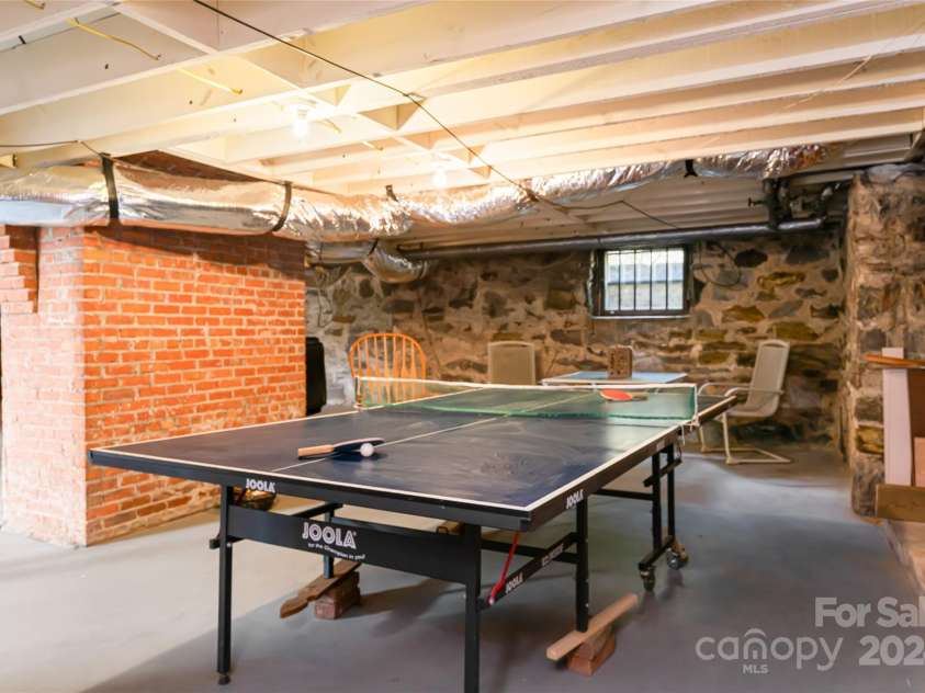 56 Sherwood Road, Asheville, NC 28803.  MLS# CAR4180458, YatesRealty ID 13457. Play Space in the Basement