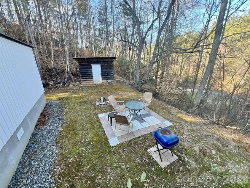 1019 Hudlin Gap Road, Pisgah Forest, NC 28768.  MLS# CAR4352720, YatesRealty ID 13458. Fire Pit