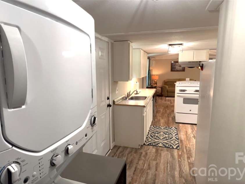1019 Hudlin Gap Road, Pisgah Forest, NC 28768.  MLS# CAR4352720, YatesRealty ID 13458. Laundry + Kitchen
