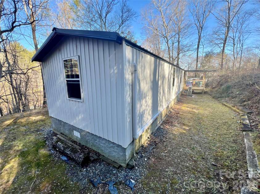 1019 Hudlin Gap Road, Pisgah Forest, NC 28768.  MLS# CAR4352720, YatesRealty ID 13458. Opposite Side Rear