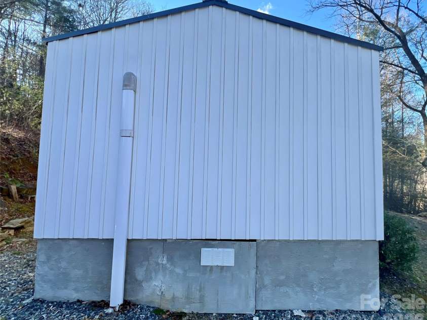 1019 Hudlin Gap Road, Pisgah Forest, NC 28768.  MLS# CAR4352720, YatesRealty ID 13458. Side