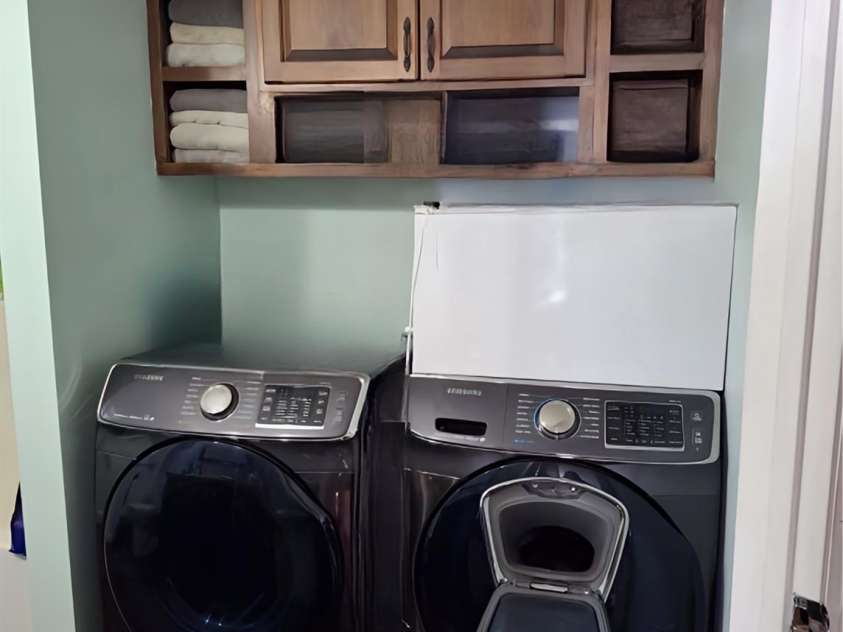 427 Weaverville Road, Asheville, NC 28804.  MLS# CAR4192228, YatesRealty ID 13458. Laundry with built in cabinets