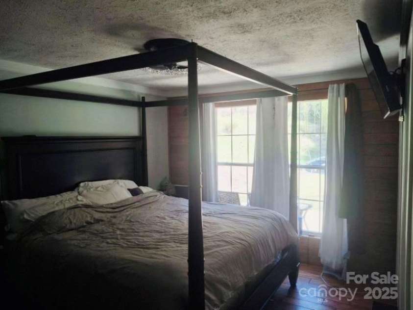 427 Weaverville Road, Asheville, NC 28804.  MLS# CAR4192228, YatesRealty ID 13458. Master bedroom has three stage remote fan with three stage lighting. Double pane, folding windows.