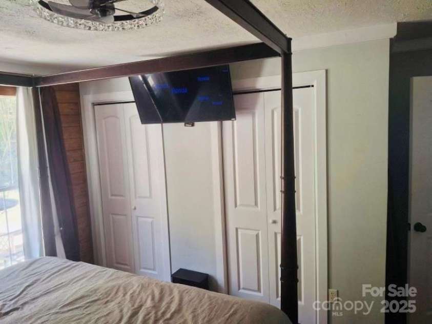 427 Weaverville Road, Asheville, NC 28804.  MLS# CAR4192228, YatesRealty ID 13458. Master Bedroom with His and Hers Closet