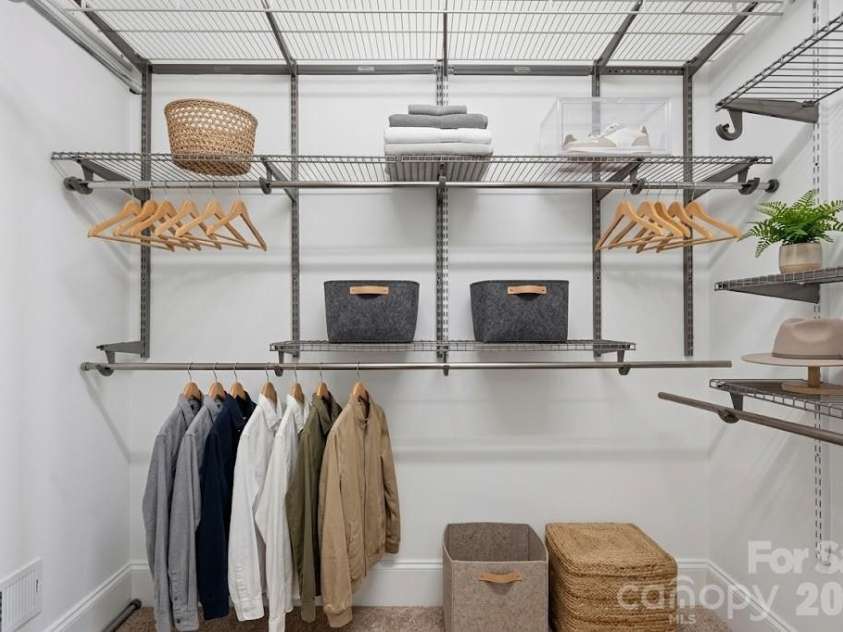 6605 Central Pacific Avenue, Charlotte, NC 28210.  MLS# CAR4423685, YatesRealty ID 13464. Owners closet has custom shelving.