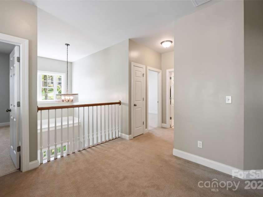 11 La Rue Court, Candler, NC 28715.  MLS# CAR4242161, YatesRealty ID 13467. Primary bedroom, plus 3 additional bedrooms on the upper level