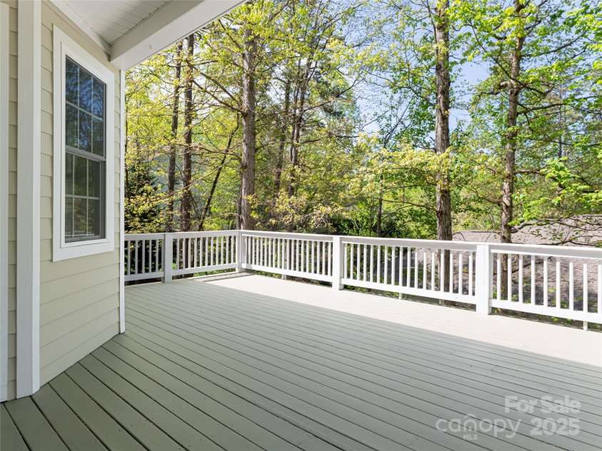 11 La Rue Court, Candler, NC 28715.  MLS# CAR4242161, YatesRealty ID 13467. The open upper deck is accessed off of the breakfast nook and family room creating a fantastic entertaining space