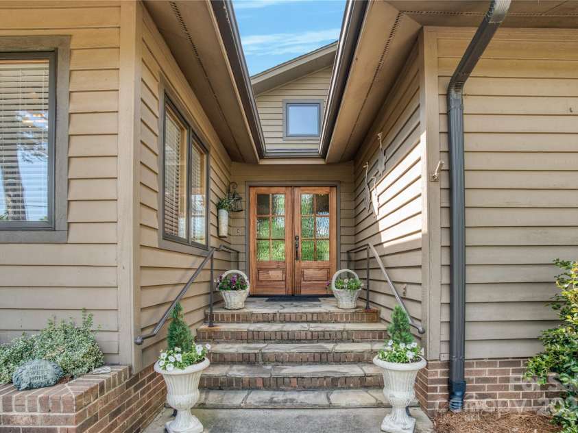 10315 Washam Potts Road, Cornelius, NC 28031.  MLS# CAR4243746, YatesRealty ID 13468. Main entrance with new front doors