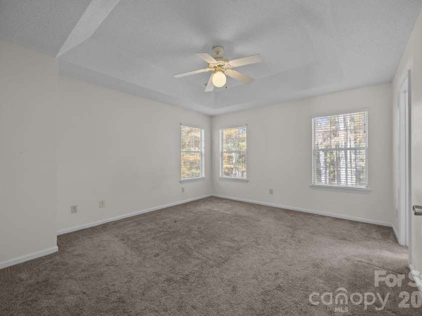 9201 Rotherham Lane, Charlotte, NC 28216.  MLS# CAR4316526, YatesRealty ID 13468. Primary bedroom with elegant ceiling