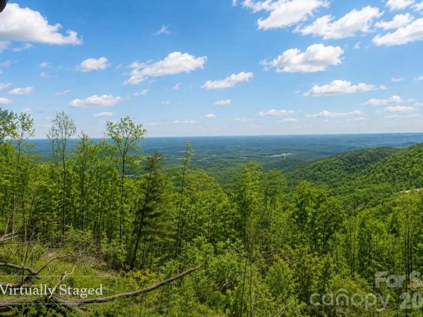 2280 Pinnacle Parkway, Union Mills, NC 28167.  MLS# CAR4363035, YatesRealty ID 13469. Virtually staged to show potential summer scenery