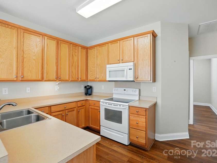 2323 Granville Place, Monroe, NC 28110.  MLS# CAR4256900, YatesRealty ID 13473. VIEW OF KITCHEN FROM BAR
