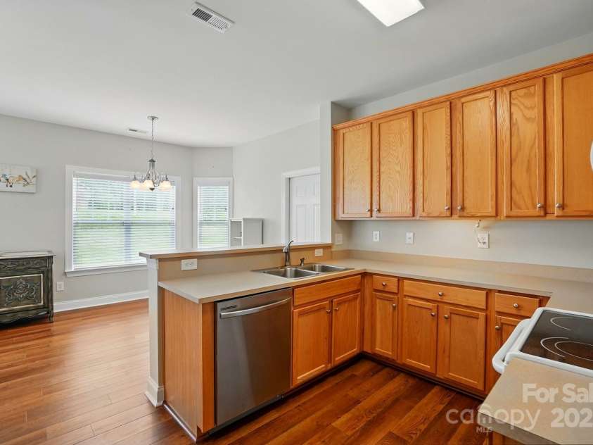 2323 Granville Place, Monroe, NC 28110.  MLS# CAR4256900, YatesRealty ID 13473. VIEW OF KITCHEN FROM LIVING ROOM