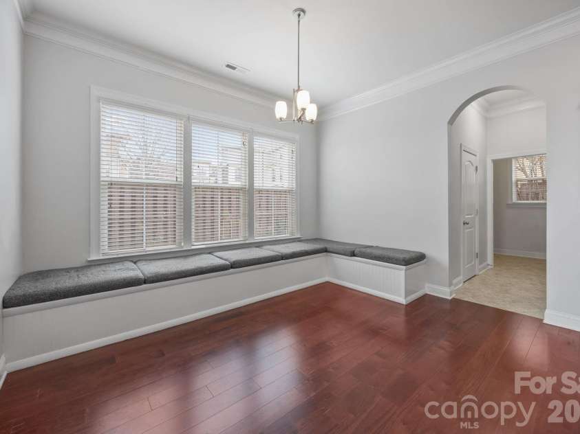 821 Herrin Avenue, Charlotte, NC 28205.  MLS# CAR4341670, YatesRealty ID 13492.  Beyond the high-end finishes, the kitchen boasts charming built-in benches, creating a custom breakfast nook or a social hub for casual dining.