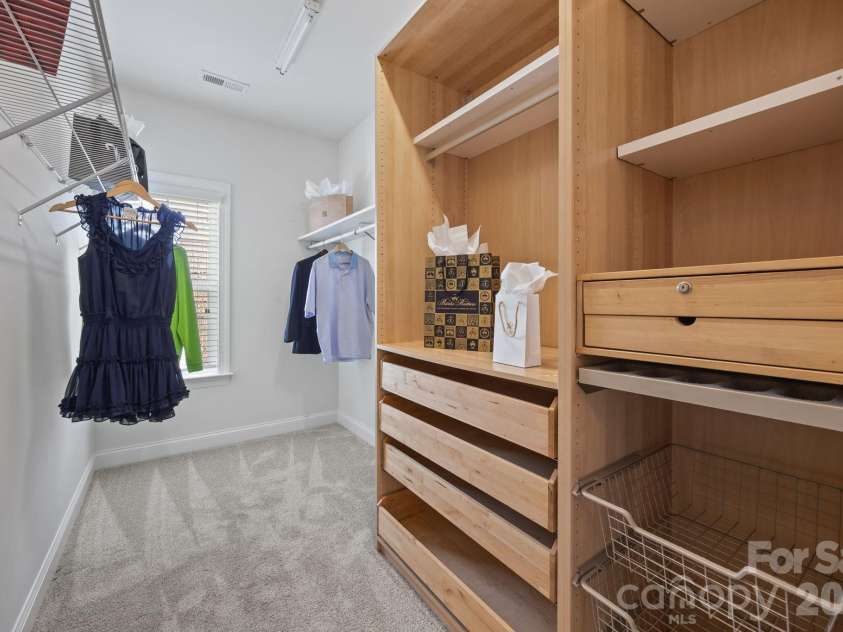 821 Herrin Avenue, Charlotte, NC 28205.  MLS# CAR4341670, YatesRealty ID 13492. Organization is effortless with the spacious walk-in closet featuring custom built-in shelving.