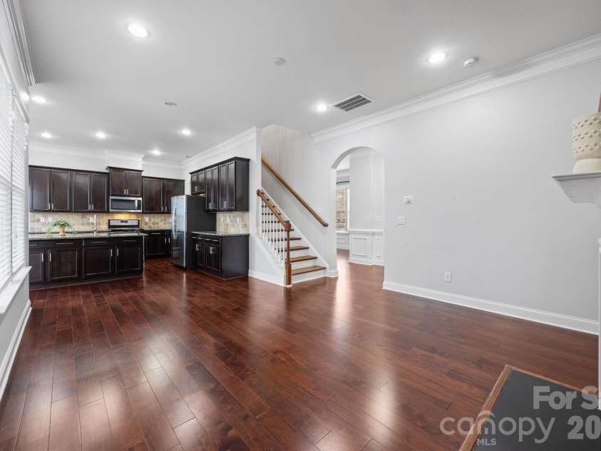 821 Herrin Avenue, Charlotte, NC 28205.  MLS# CAR4341670, YatesRealty ID 13492. The open-concept first floor is designed for flow, featuring a seamless transition between the kitchen and living spaces—ideal for the modern host.