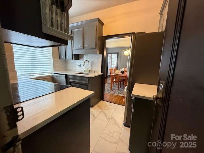 301 10th Street, Charlotte, NC 28202.  MLS# CAR4299886, YatesRealty ID 13498. Updated kitchen leads to large Dining Room