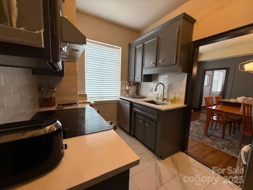 301 10th Street, Charlotte, NC 28202.  MLS# CAR4299886, YatesRealty ID 13498. View from kitchen looking into Dining Room.