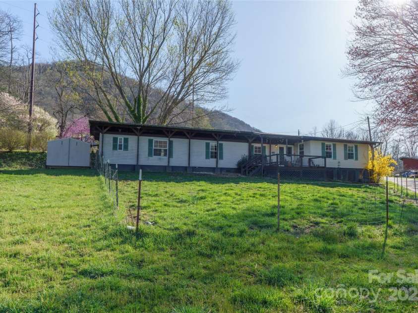 51 Ferguson Lane, Maggie Valley, NC 28751.  MLS# CAR4242031, YatesRealty ID 13499. Big flat yard