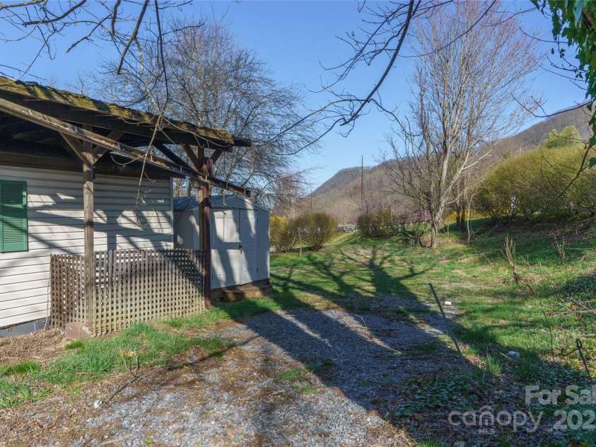 51 Ferguson Lane, Maggie Valley, NC 28751.  MLS# CAR4242031, YatesRealty ID 13499. Driveway to the carport
