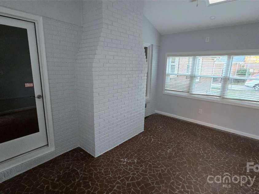 1308 Princeton Avenue, Gastonia, NC 28054.  MLS# CAR4205826, YatesRealty ID 1350. Sunroom connecting home to two car garage