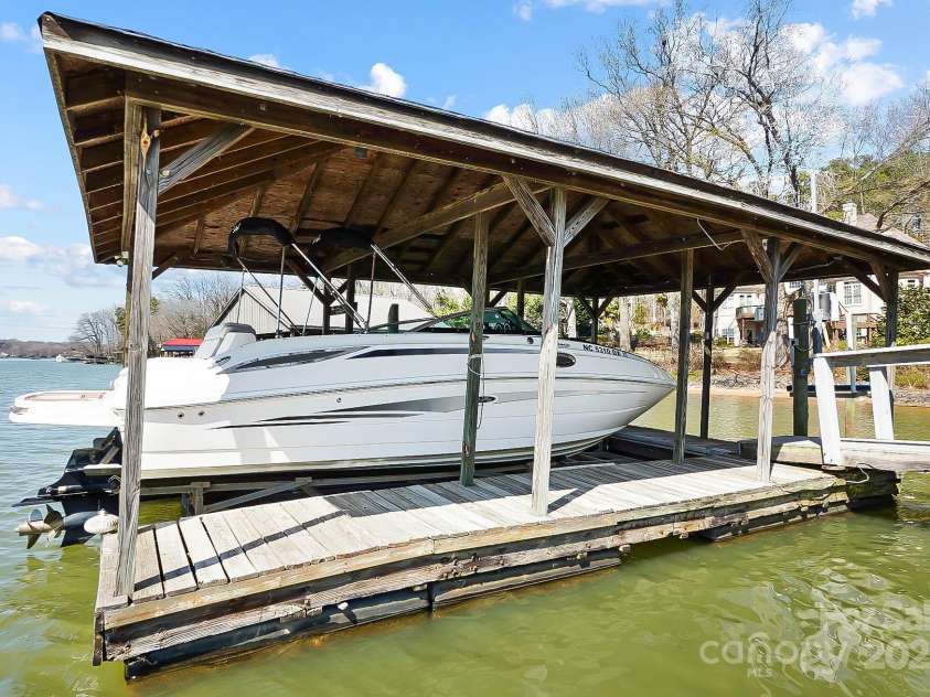 6403 Amos Smith Road, Charlotte, NC 28214.  MLS# CAR4233233, YatesRealty ID 13507. Enjoy boating adventures from your covered dock w/ boat lift & jet ski lift