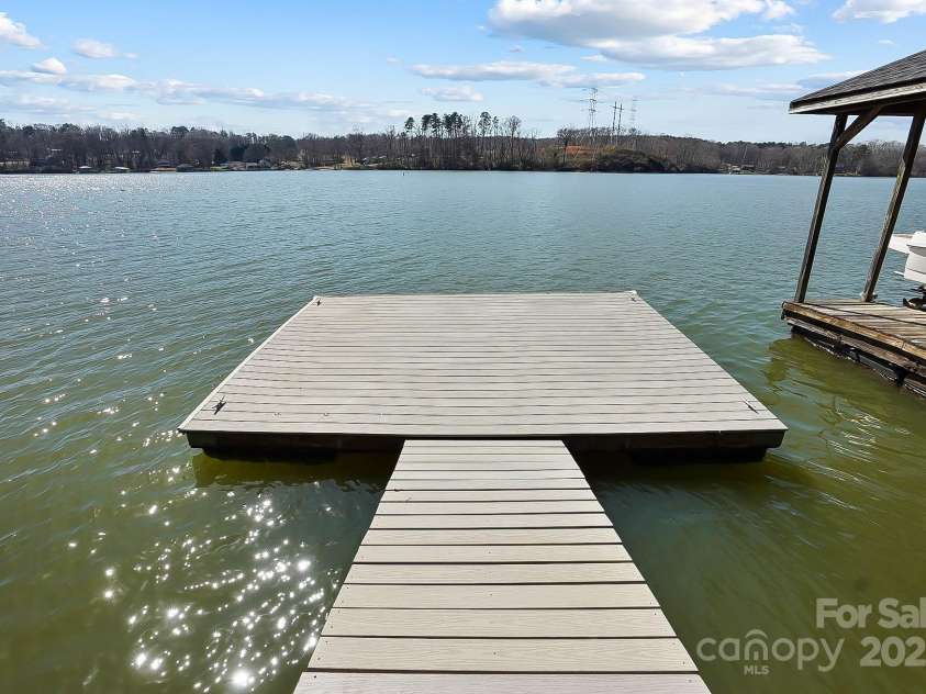 6403 Amos Smith Road, Charlotte, NC 28214.  MLS# CAR4233233, YatesRealty ID 13507. Floating dock is perfect for swimming, fishing and water adventures