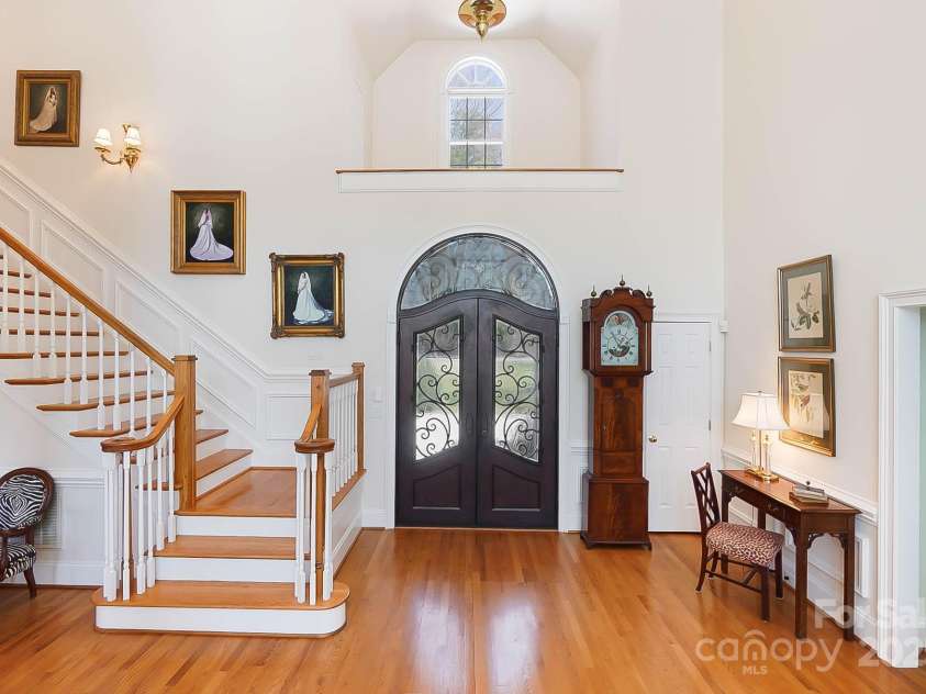 6403 Amos Smith Road, Charlotte, NC 28214.  MLS# CAR4233233, YatesRealty ID 13507. The grand foyer welcomes you into a soaring two-story great room, where a fireplace and built-in cabinetry create a warm and inviting ambiance