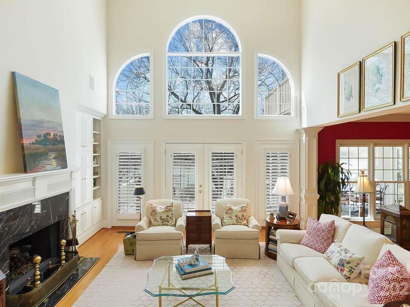6403 Amos Smith Road, Charlotte, NC 28214.  MLS# CAR4233233, YatesRealty ID 13507. This entertainer's dream home is a symphony of exquisite architectural details, rich hardwood floors, intricate moldings, and breathtaking lake views that permeate every room