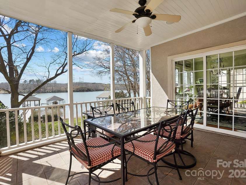 6403 Amos Smith Road, Charlotte, NC 28214.  MLS# CAR4233233, YatesRealty ID 13507. You’ll spend hours lingering over morning coffee, reading a book, or relaxing & enjoying the impressive lake views from the fabulous screened porch