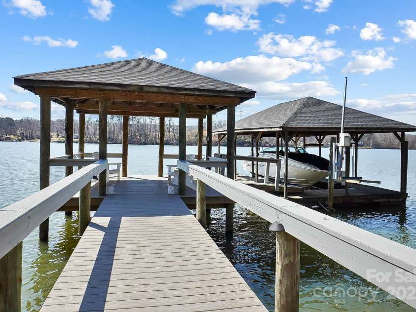 6403 Amos Smith Road, Charlotte, NC 28214.  MLS# CAR4233233, YatesRealty ID 13507. Your private covered dock, complete with a boat lift and jet ski lift, invites you to explore the waters of Lake Wylie