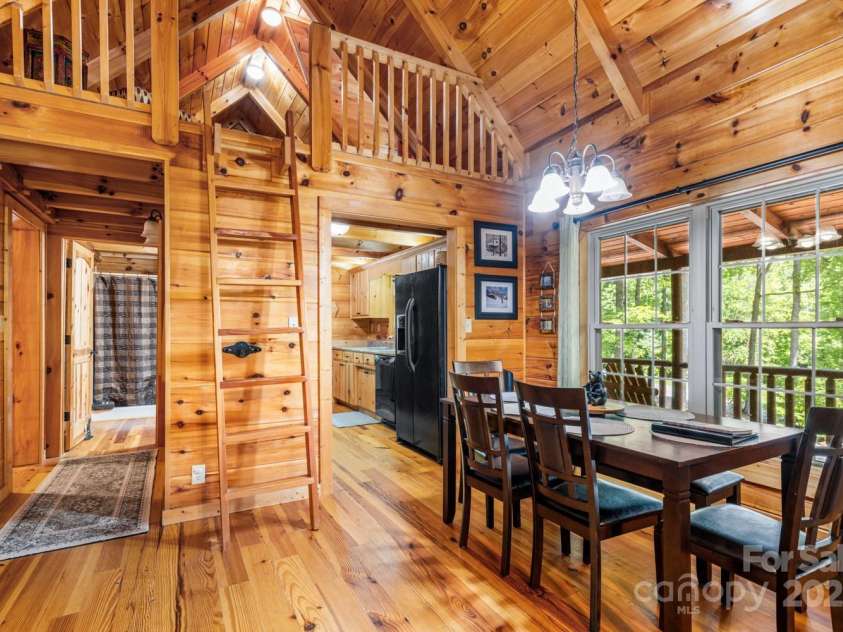 28 Upper Ridge Road, Black Mountain, NC 28711.  MLS# CAR4274380, YatesRealty ID 1351. Dinging room space leading into kitchen. Access to lofted sleeping space at 26 Upper Ridge