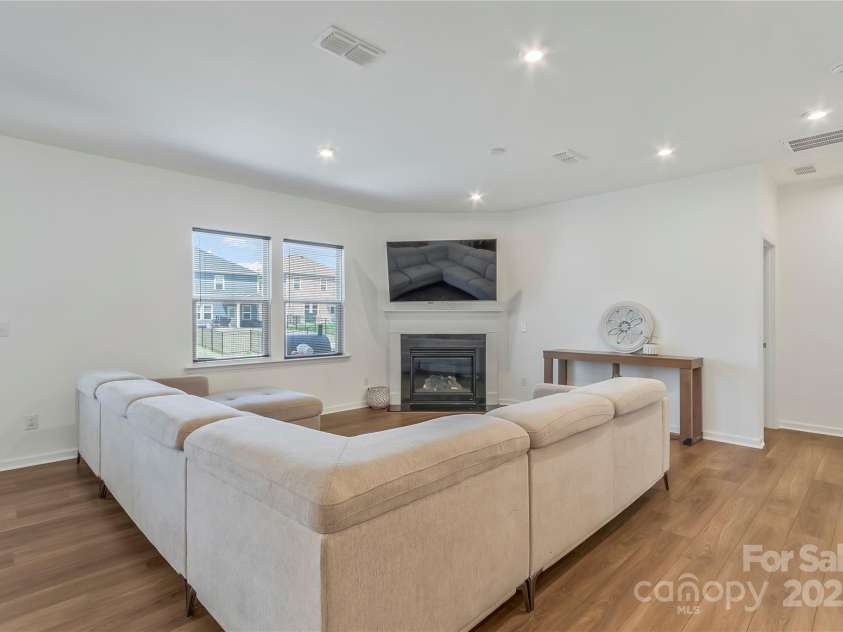 14224 Canemeadow Drive, Charlotte, NC 28278.  MLS# CAR4246314, YatesRealty ID 13517. Family room. Great for entertaining by the gas log fireplace.