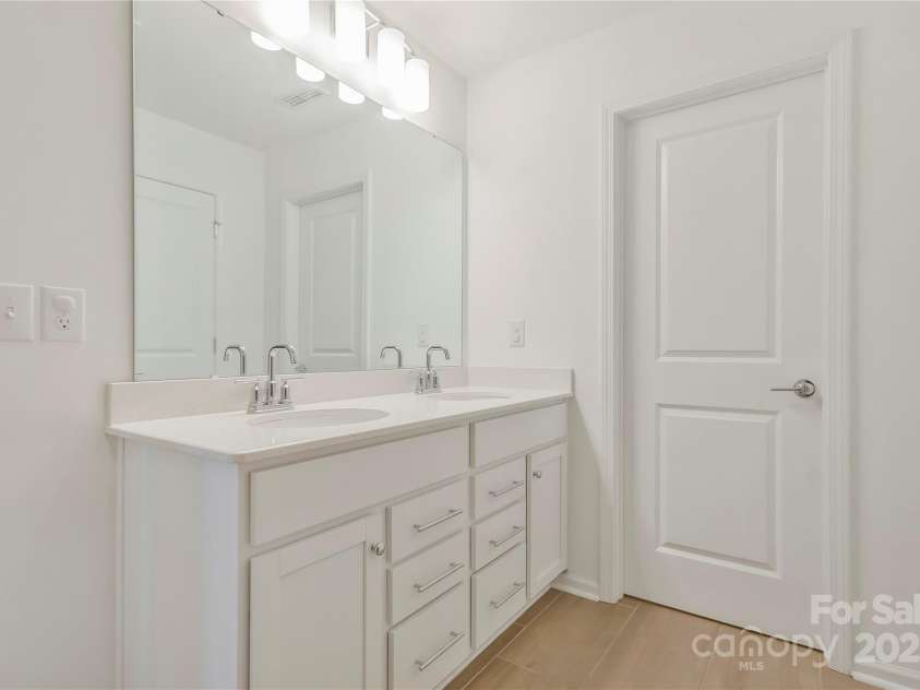 14224 Canemeadow Drive, Charlotte, NC 28278.  MLS# CAR4246314, YatesRealty ID 13517. Primary ensuite has dual vanity and water closet for privacy.