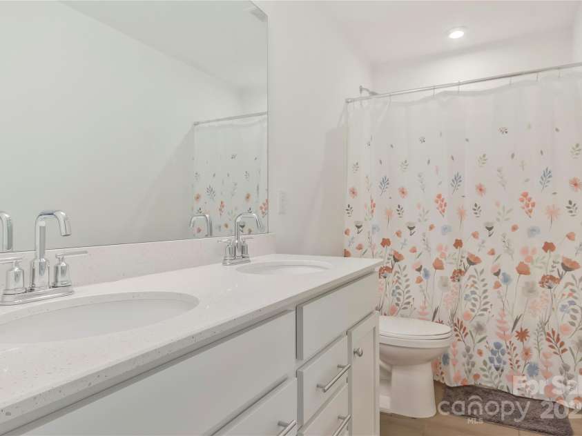 14224 Canemeadow Drive, Charlotte, NC 28278.  MLS# CAR4246314, YatesRealty ID 13517. Secondary bathroom with dual vanity upstairs.