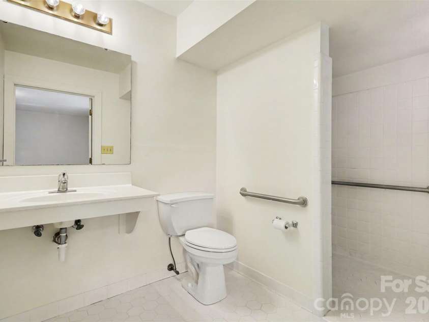 804 Phillips Street, Shelby, NC 28150.  MLS# CAR4367322, YatesRealty ID 13526. The primary bath is fully accessible with a 60 inch turning radius, roll in shower, grab bars, raised toilet, lever faucets, low mirror, and roll under sink.