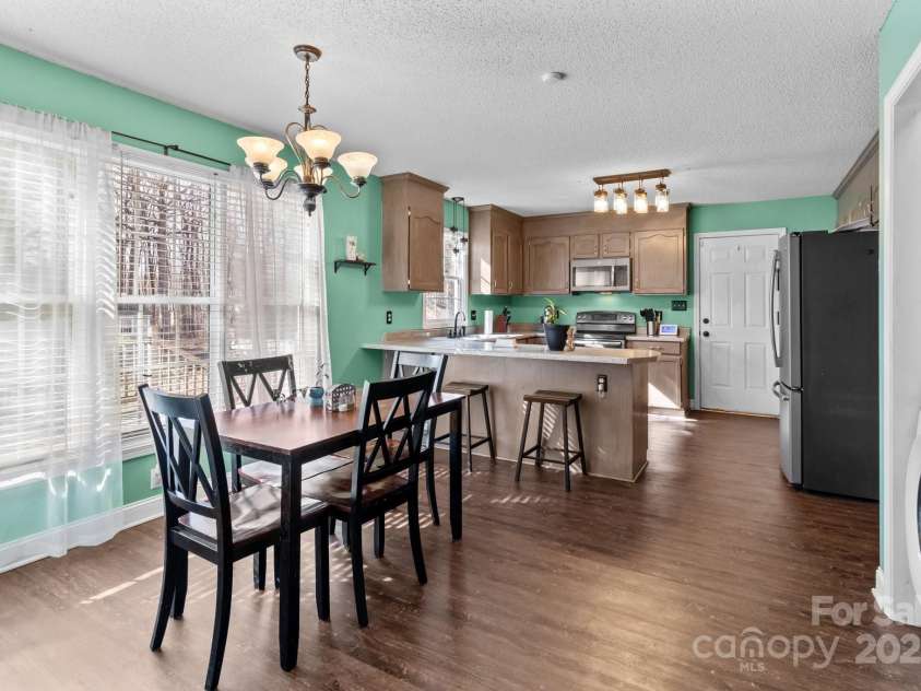 697 Maple Ridge Circle, Salisbury, NC 28147.  MLS# CAR4205711, YatesRealty ID 1353. Light-filled dining area with large window to backyard