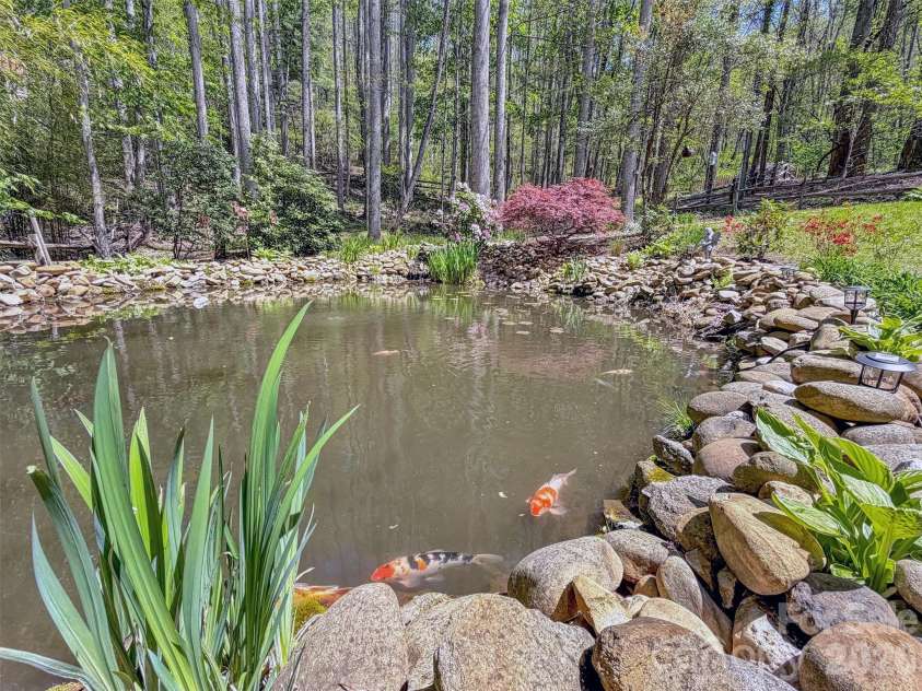 211 Rustic Road, Waynesville, NC 28786.  MLS# CAR4371760, YatesRealty ID 13537. Fabulous Pond