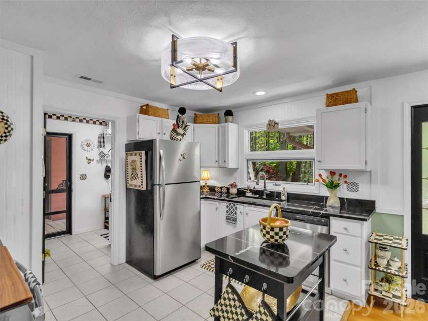 211 Rustic Road, Waynesville, NC 28786.  MLS# CAR4371760, YatesRealty ID 13537. Kitchen Opens to Laundry