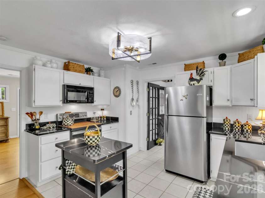211 Rustic Road, Waynesville, NC 28786.  MLS# CAR4371760, YatesRealty ID 13537. Kitchen with Ample Cabinetry
