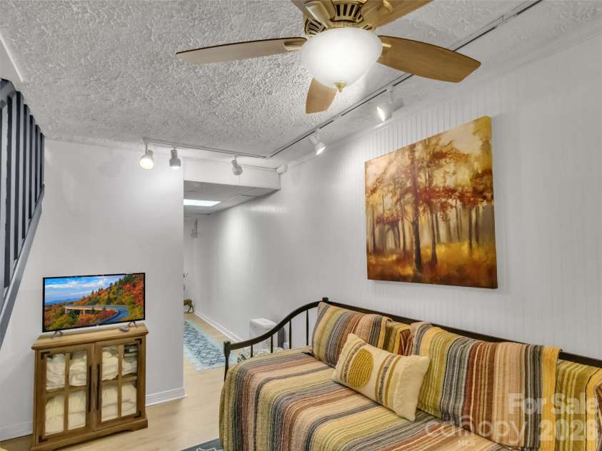 211 Rustic Road, Waynesville, NC 28786.  MLS# CAR4371760, YatesRealty ID 13537. Lower Level Sitting Area