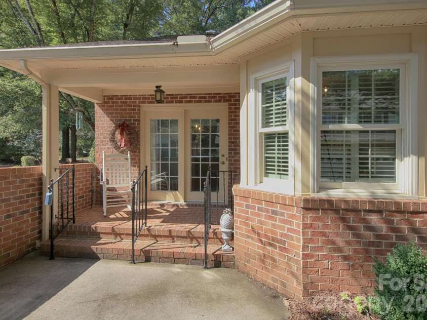 783 Union Street, Concord, NC 28025.  MLS# CAR4298799, YatesRealty ID 13541. Back entrance, patio with brick wall for additional privacy